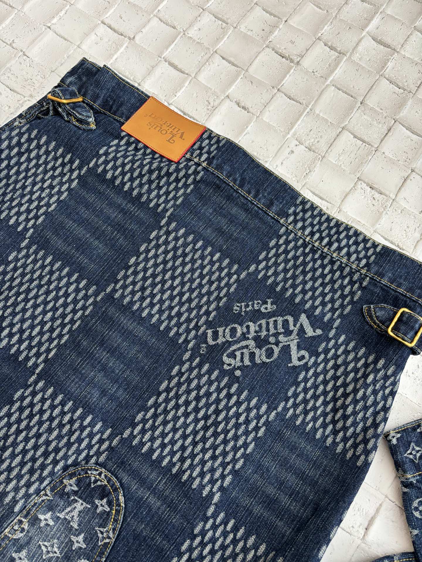 Dark blue denim shorts with LV monogram print and gold button waist