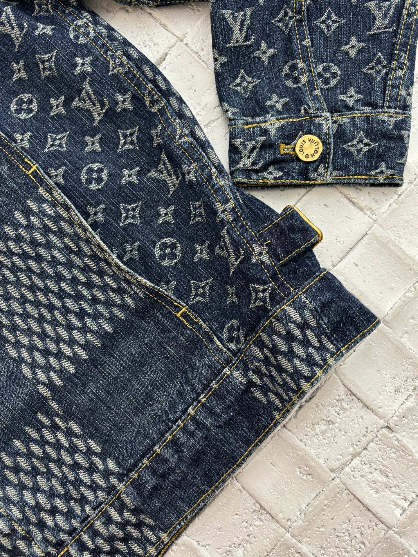 Louis Vuitton denim jacket sleeve and chest detail in blue monogram patchwork