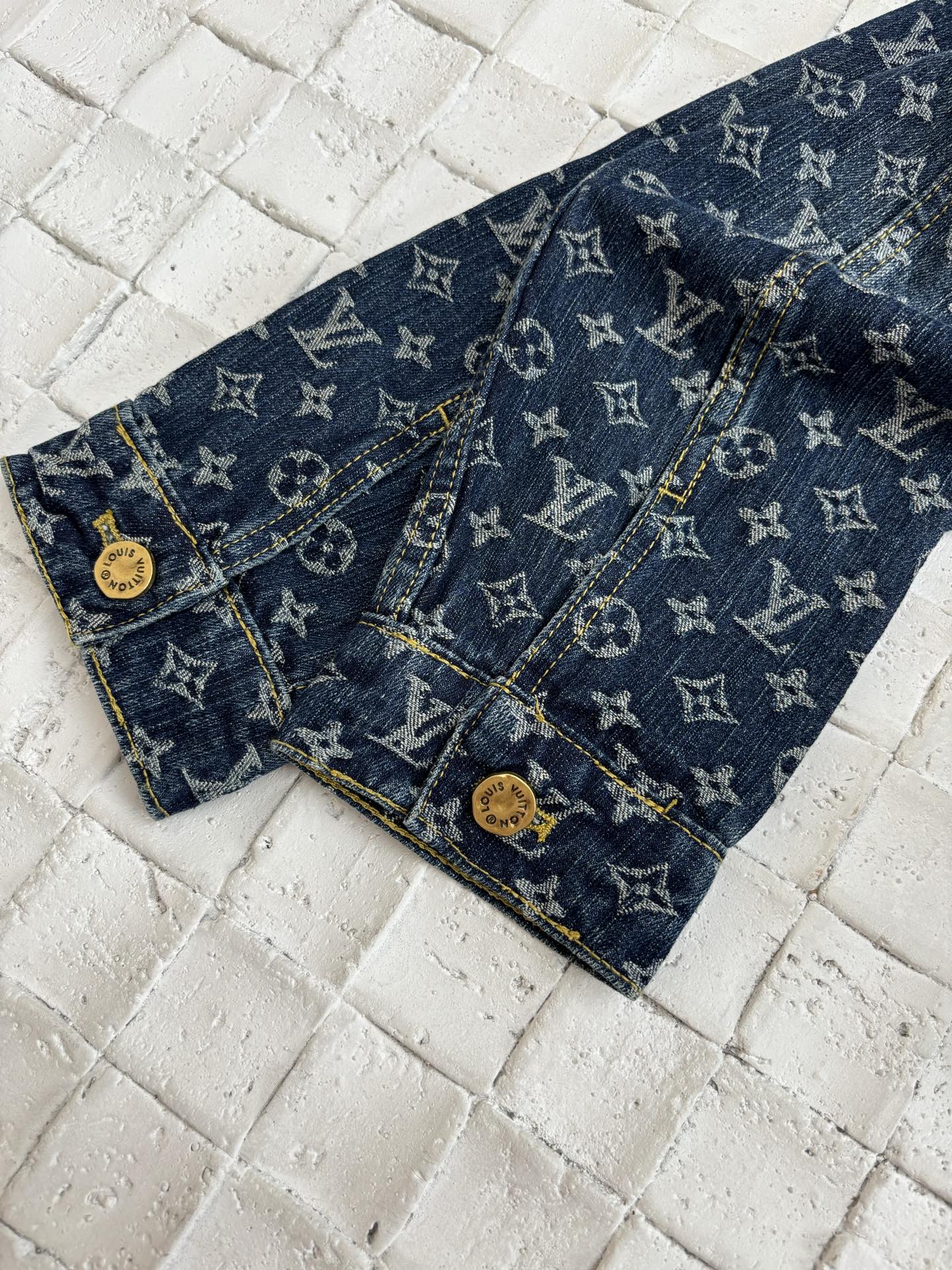 Dark blue denim shorts with LV monogram print, front pockets and stitched seams