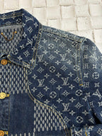 Louis Vuitton denim jacket close-up with blue monogram pattern panels and gold trim