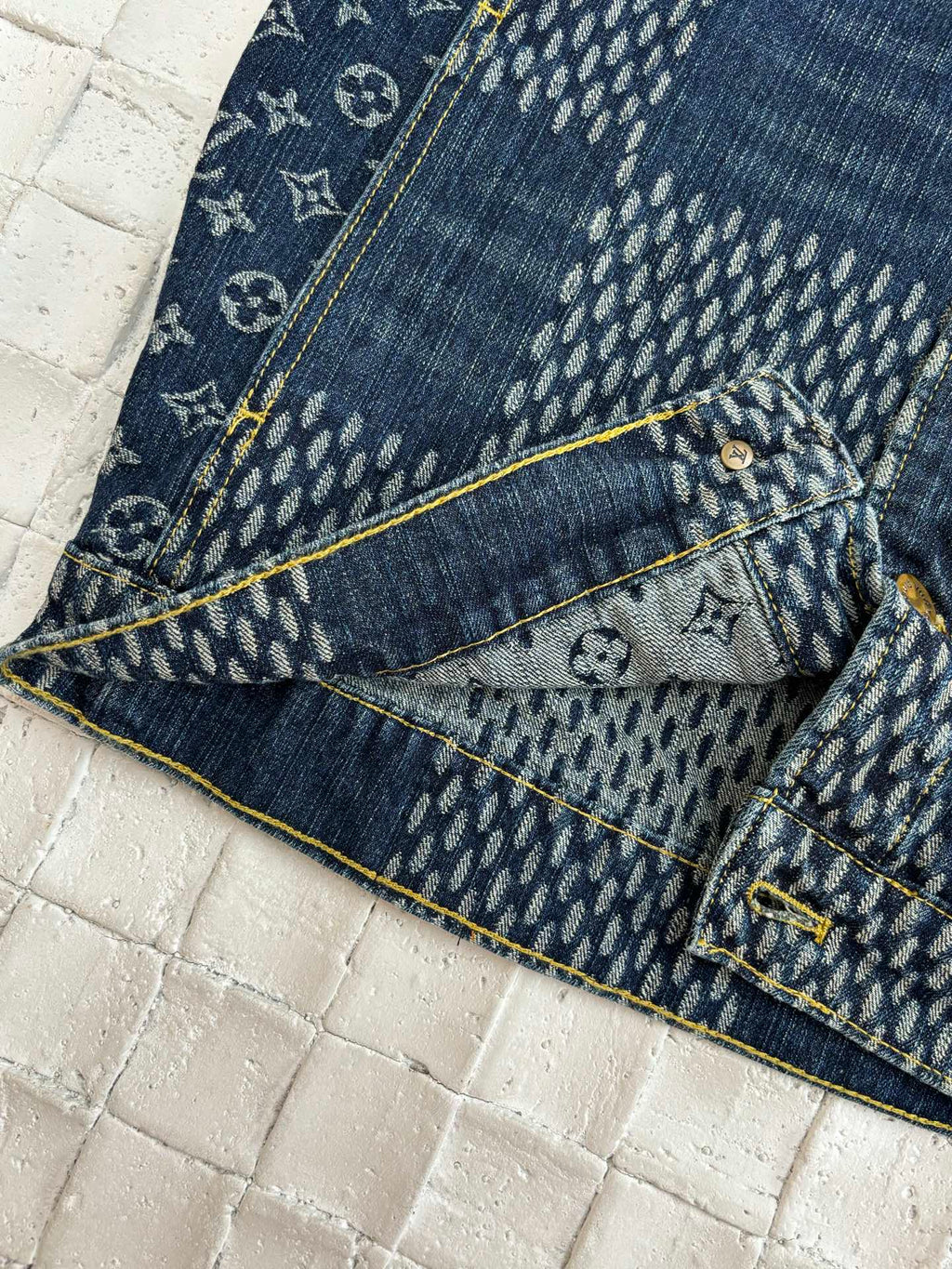 Louis Vuitton denim jacket hem and pocket area with blue monogram patchwork