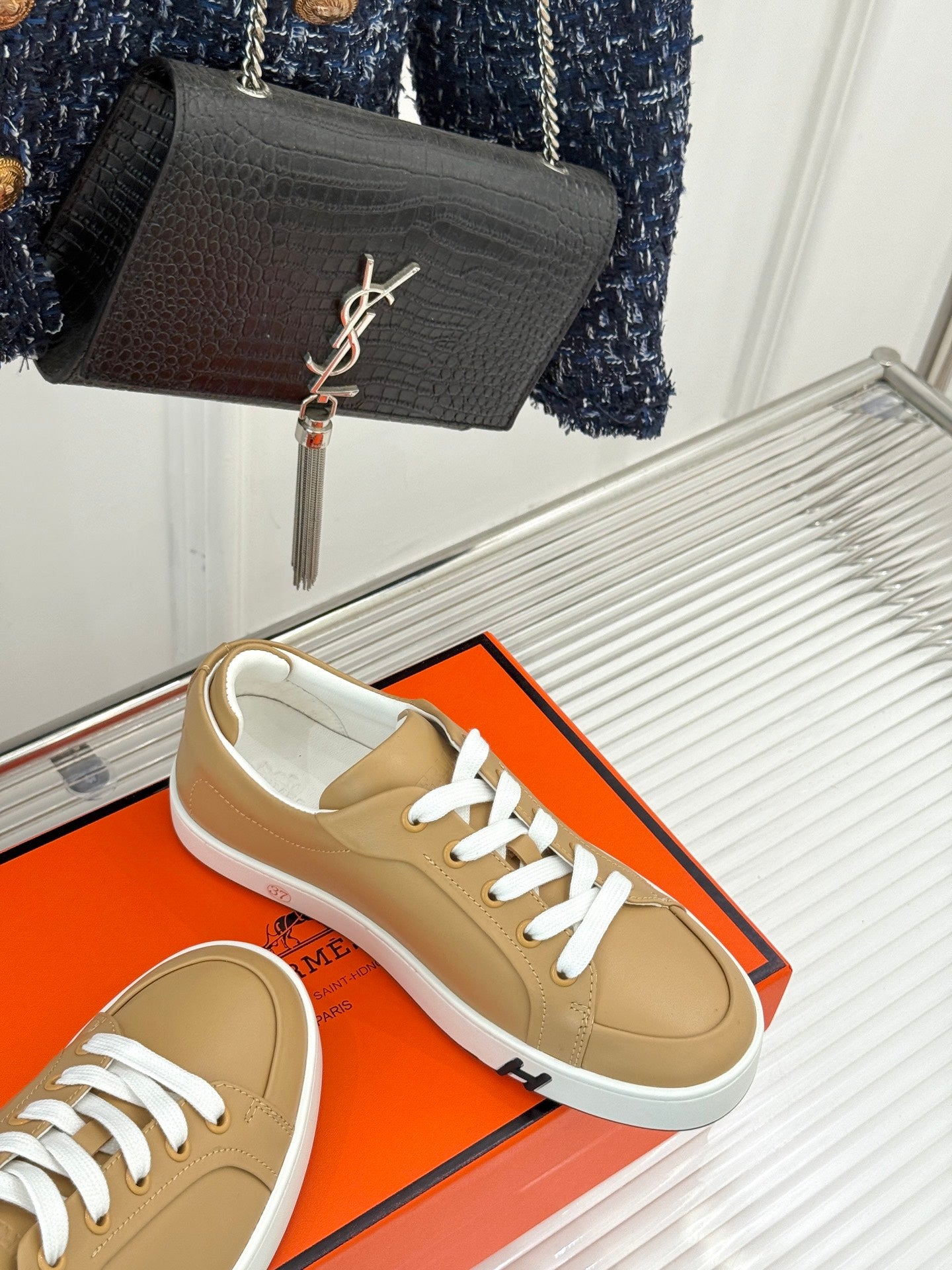 Ladies' Hermes low-top sneakers, tan leather with white laces and textured white sole