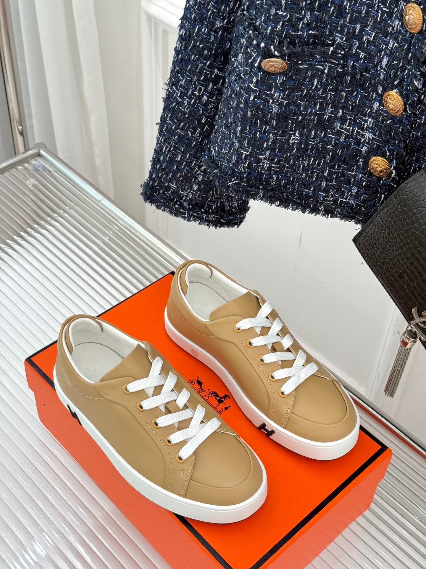 Ladies' Hermes sneakers, tan leather with white laces and low-profile rubber sole