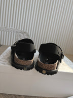 Unisex Dior black slingback buckle shoes with metal hardware and tread sole