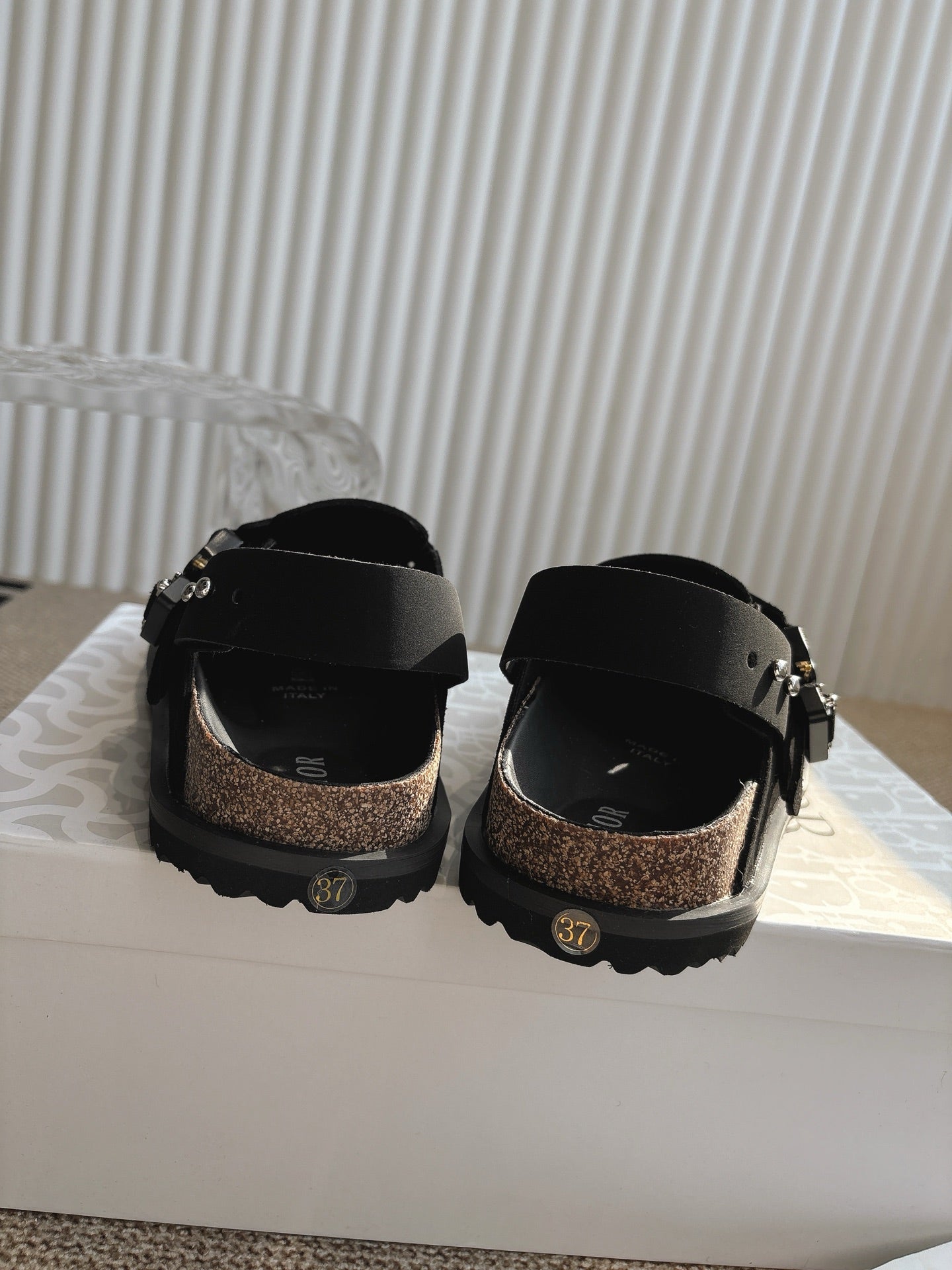 Unisex Dior black slingback buckle shoes with metal hardware and tread sole