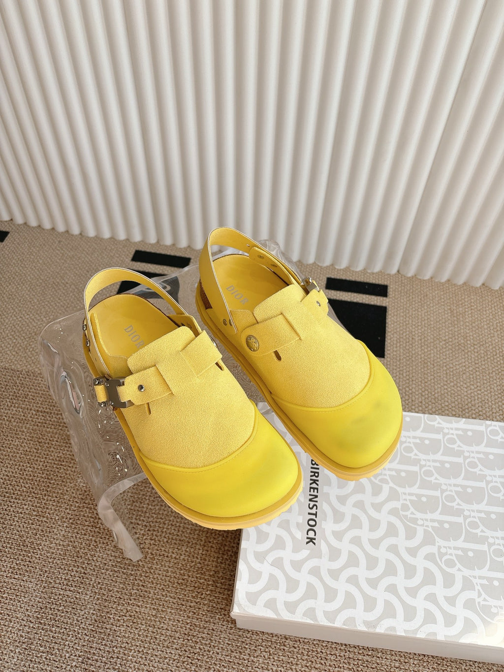Yellow unisex loafers with cross-strap buckle and ridged sole