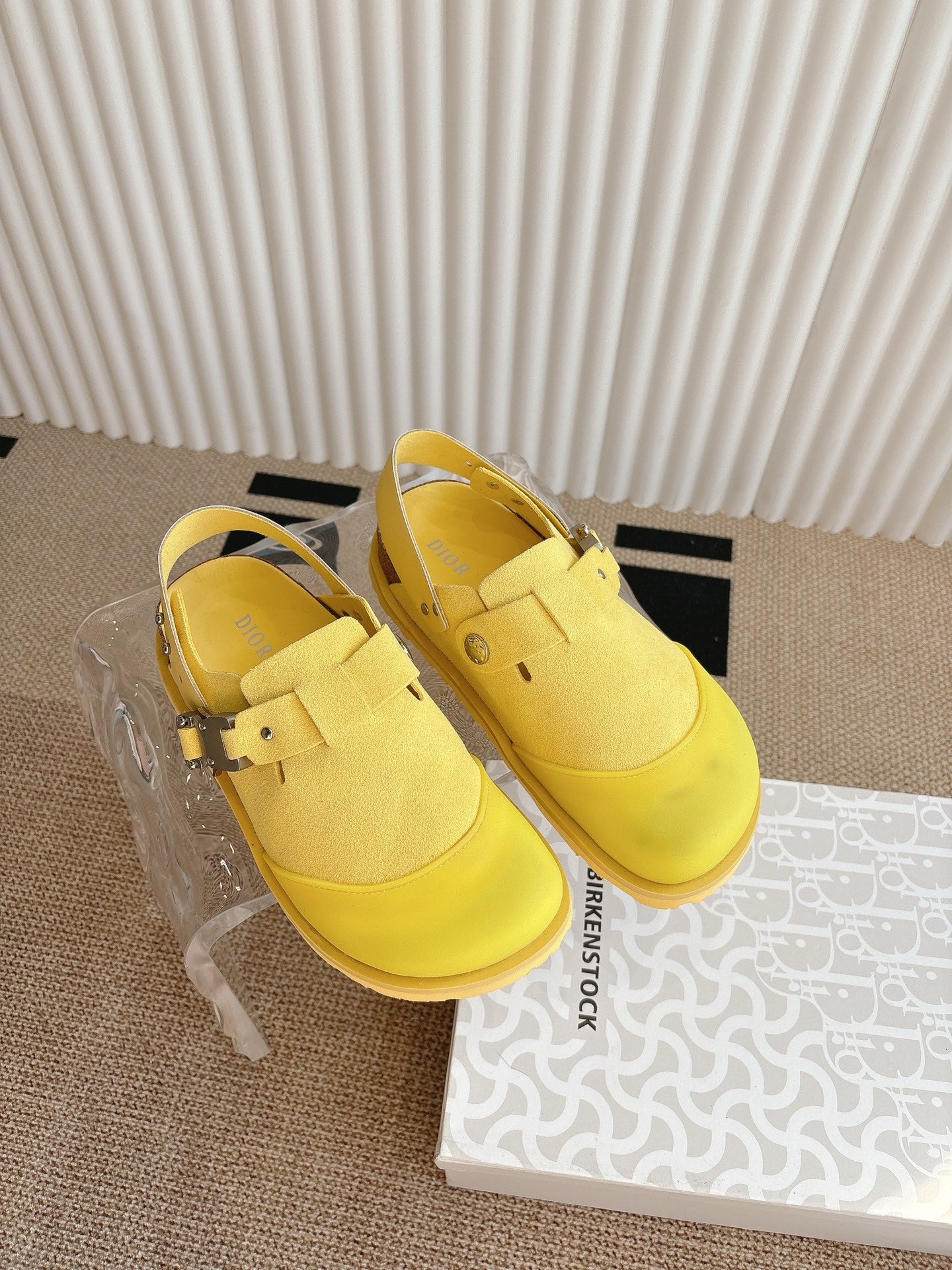 Yellow unisex loafers with cross-strap buckle and ridged sole