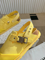 Yellow unisex shoes with double buckle strap, side and top views