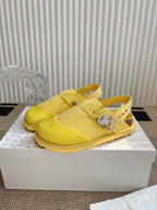 Yellow unisex slingback shoes with metal buckle and circular ornament
