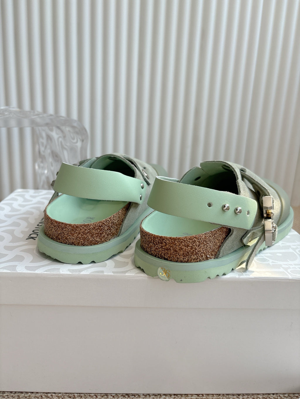 Unisex slip-on clogs, light green suede straps with stud details over cork footbed