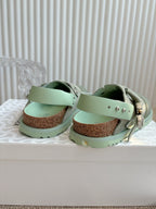 Unisex slip-on clogs, light green suede straps with stud details over cork footbed