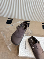 Unisex suede slip-on shoes with strap closure and buckle, dark taupe