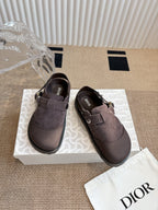 Pair of unisex suede slip-on shoes with strap closure and metal buckle, dark taupe
