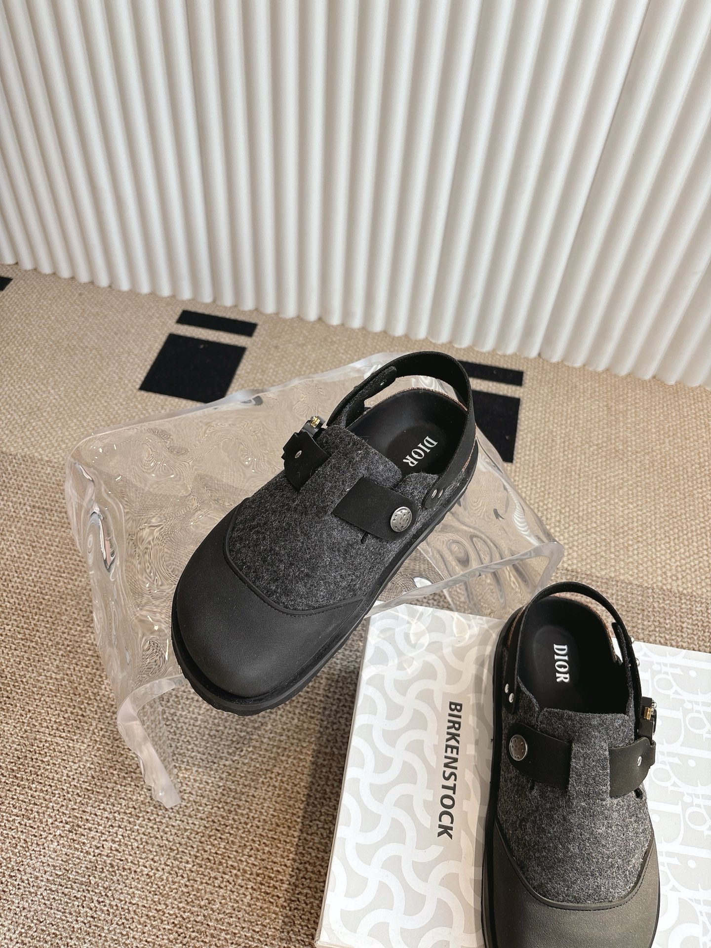 Black and dark gray slip-on shoes with felt vamp and adjustable buckle straps