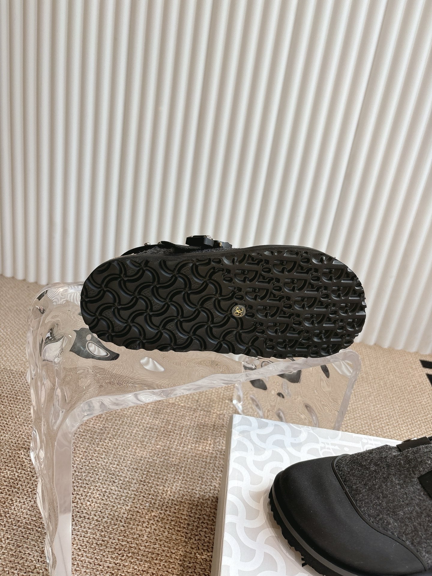 Shoe outsole with textured dark rubber tread pattern