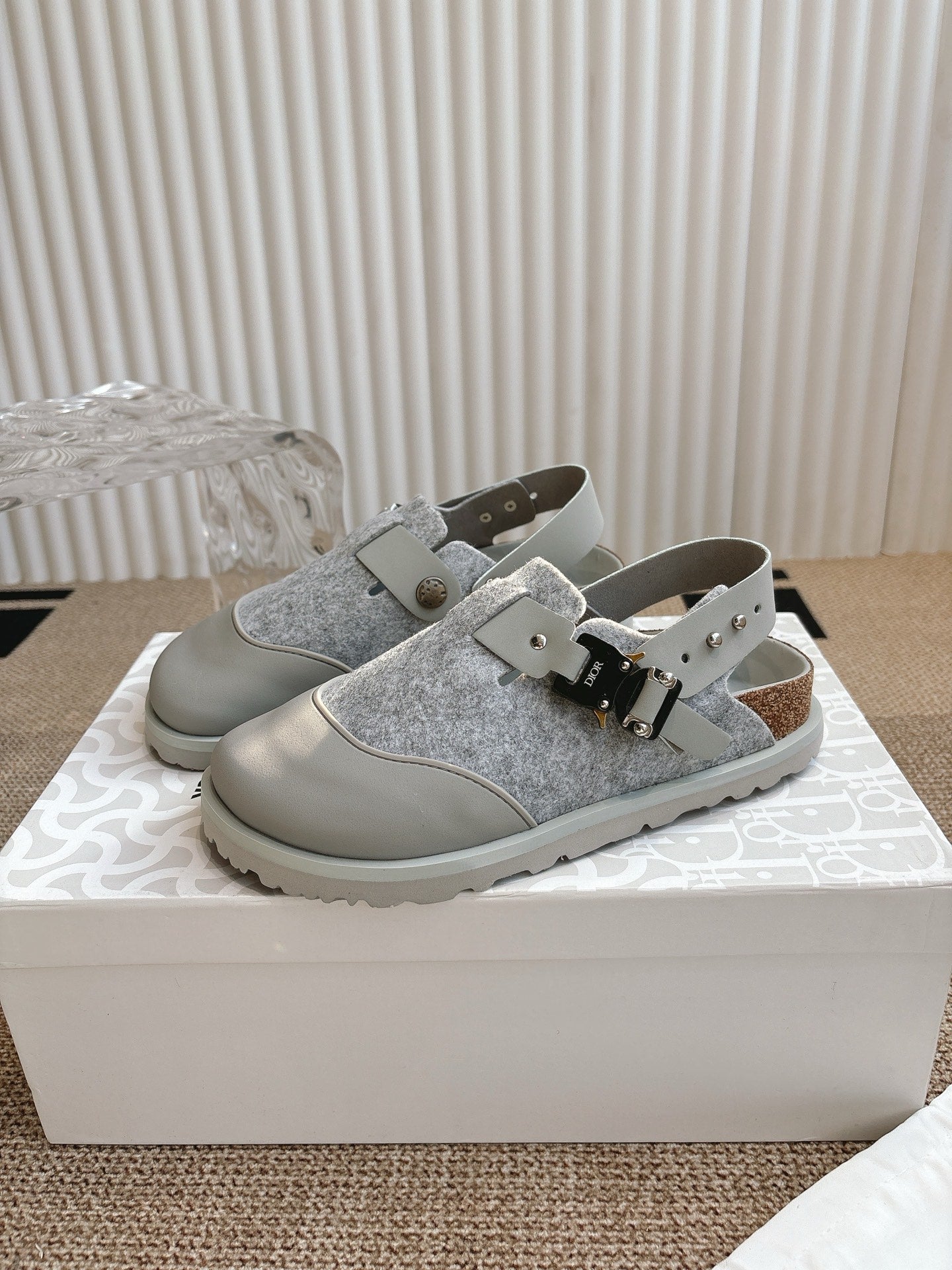 Dior unisex low-top shoes with gray textured uppers, white straps, and metal buckles