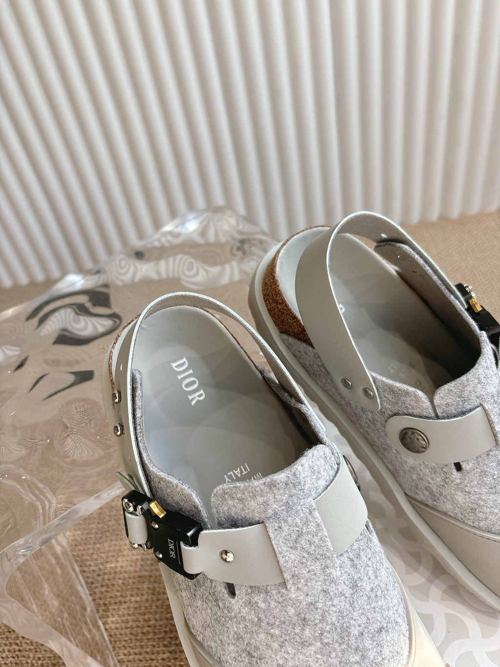 Dior unisex shoes with gray textured lining and white ankle strap with gold-tone details
