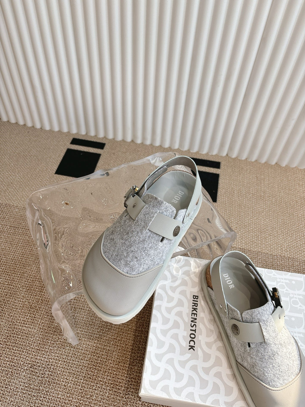 Dior unisex shoes with white toe caps, gray glitter uppers, and strap buckle detail