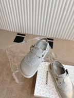 Dior unisex shoes with white toe caps, gray glitter uppers, and strap buckle detail
