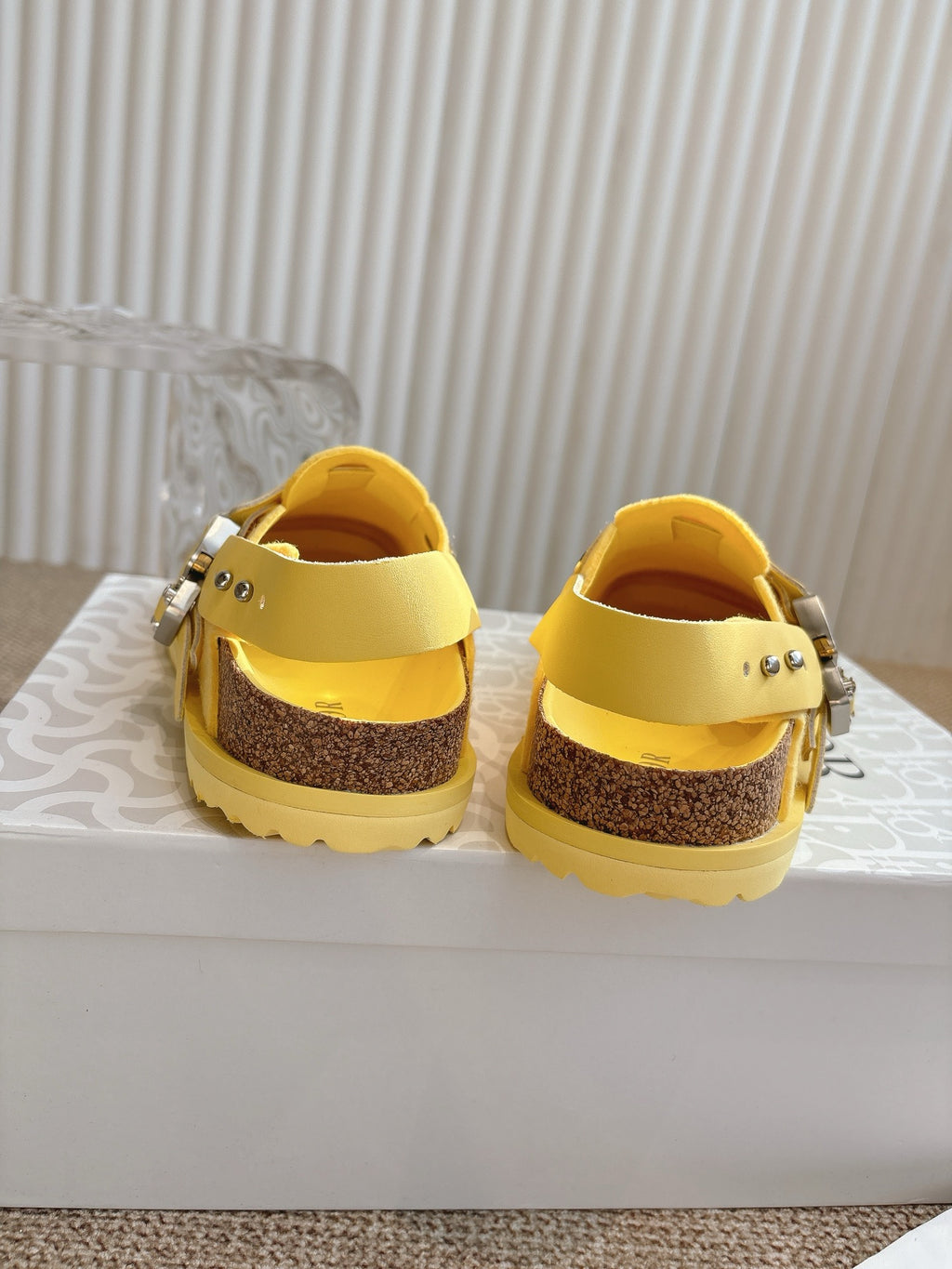 Dior unisex yellow slip-on shoes heel view with brown insole and buckle strap