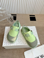 Unisex green sneakers with double strap and metal buckle, side view