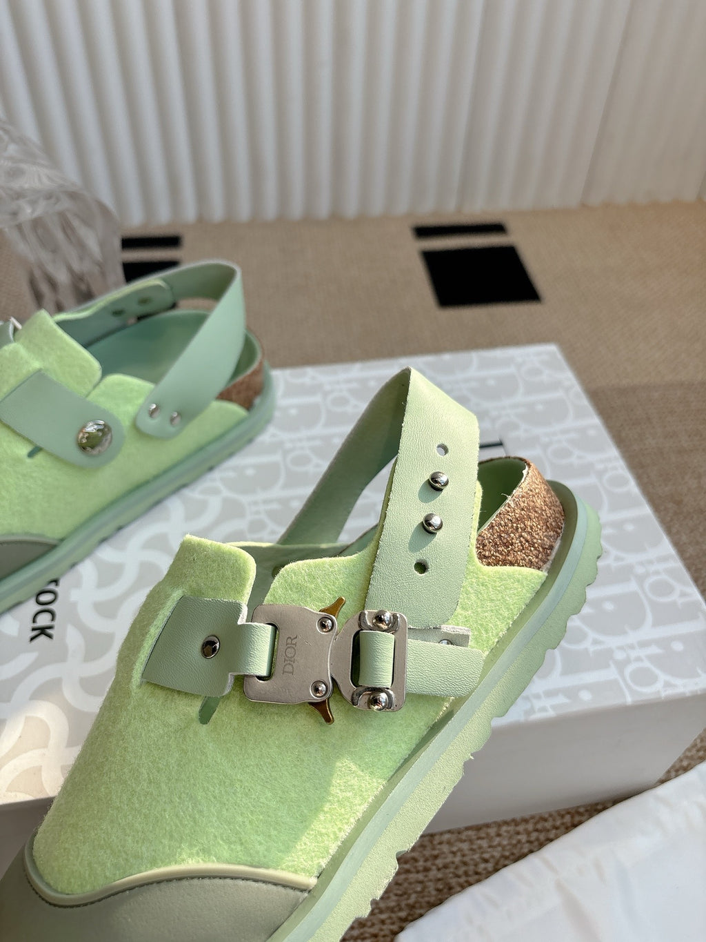 Unisex green sneakers with adjustable strap and buckle, front view