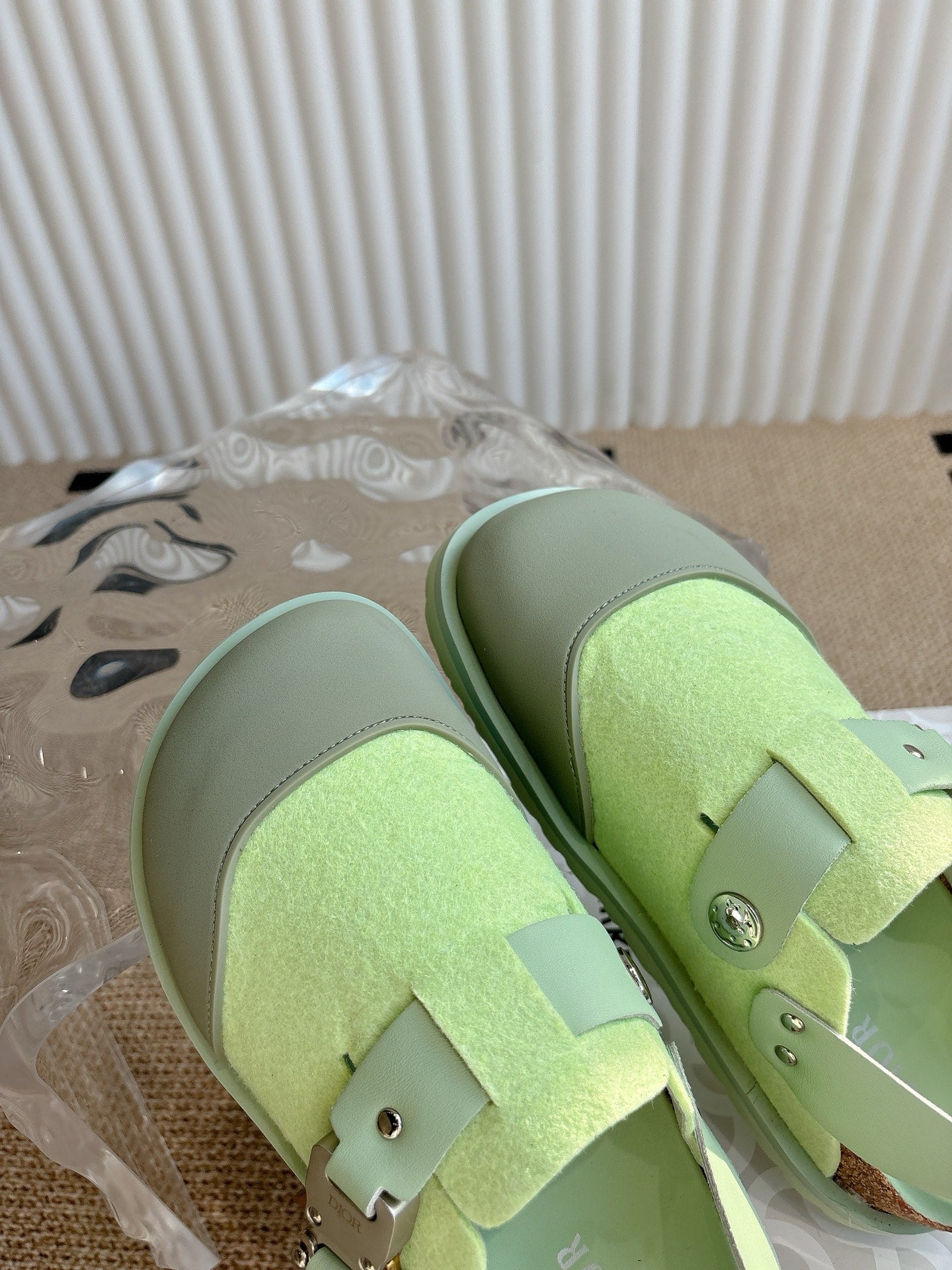 Unisex green sneakers with double straps and metal studs, top angle view