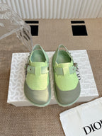 Unisex green sneakers with adjustable strap and metal buckle detail