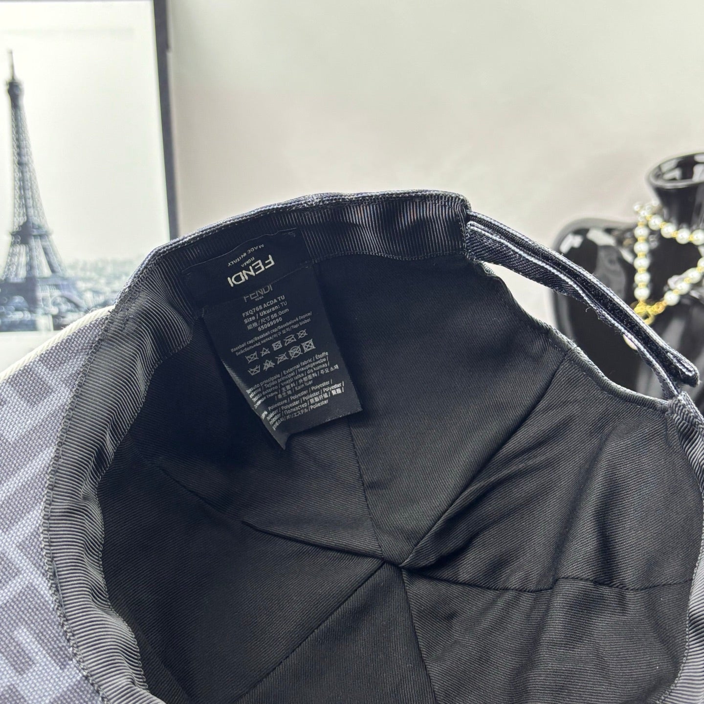 Gray FF monogram cap interior with black lining and label tag