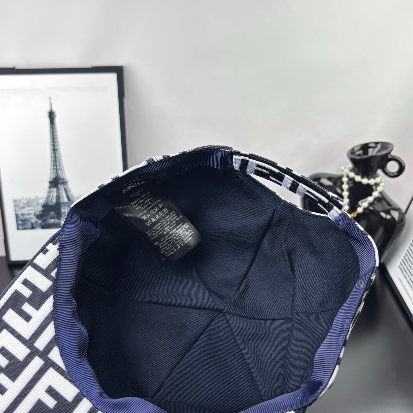 Fendi cap interior with navy lining and stitched band trim, open crown view
