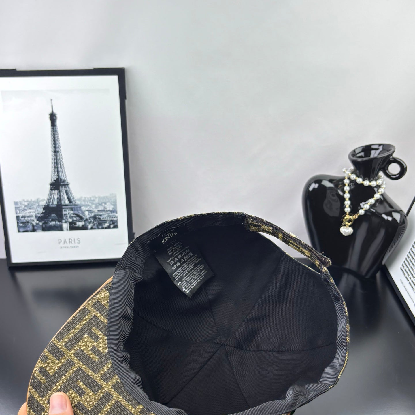 Fendi cap interior view with dark lining and stitched crown panels