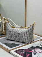 Dior monogram hobo bag with chain strap and gold hardware, blue and white