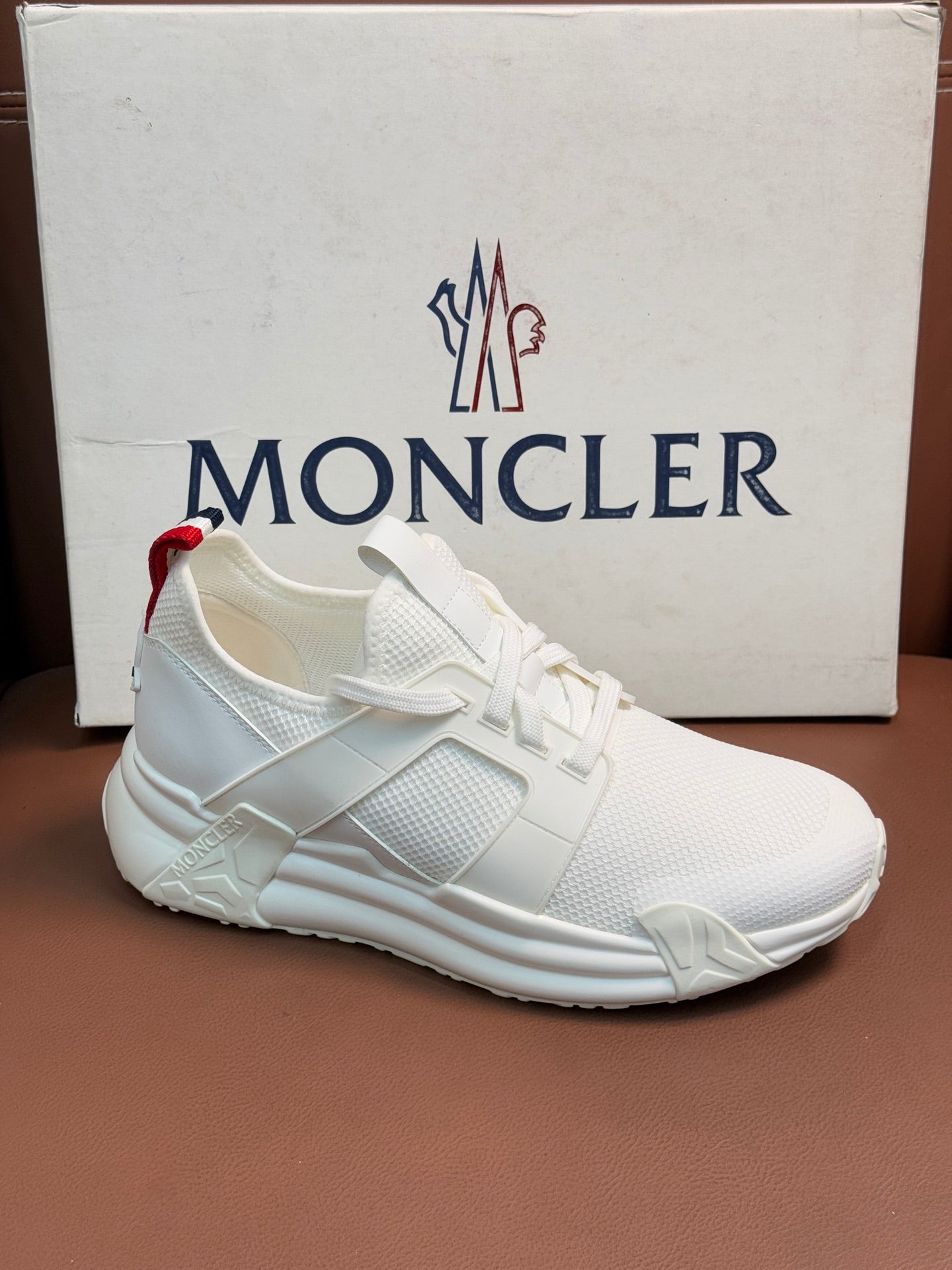 Moncler white knit sneakers with lace-up front and red/navy heel strap
