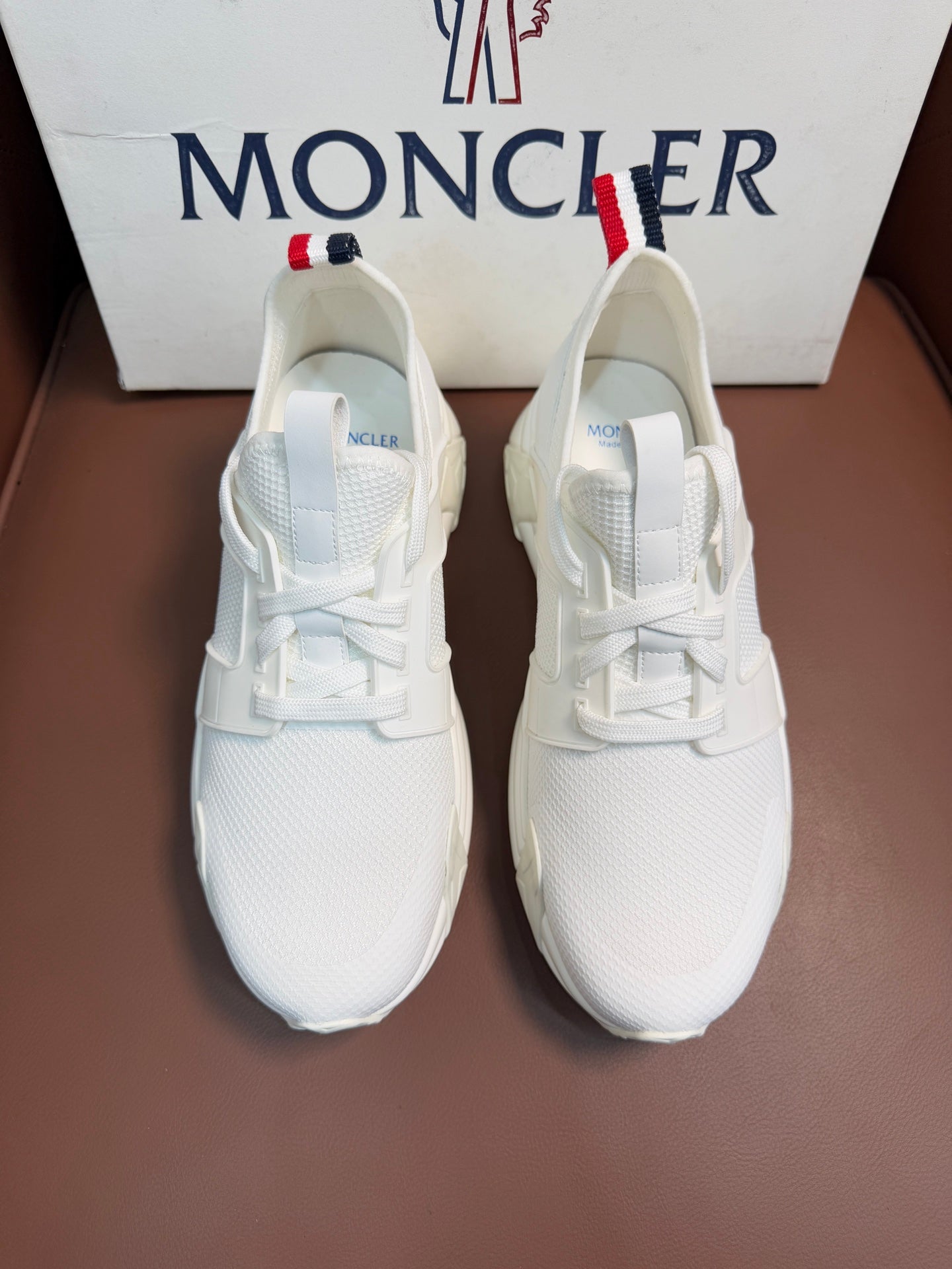 Moncler white lace-up sneakers with textured upper and chunky sole