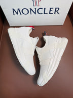 Moncler white lace-up sneakers, front angle, padded tongue and collar