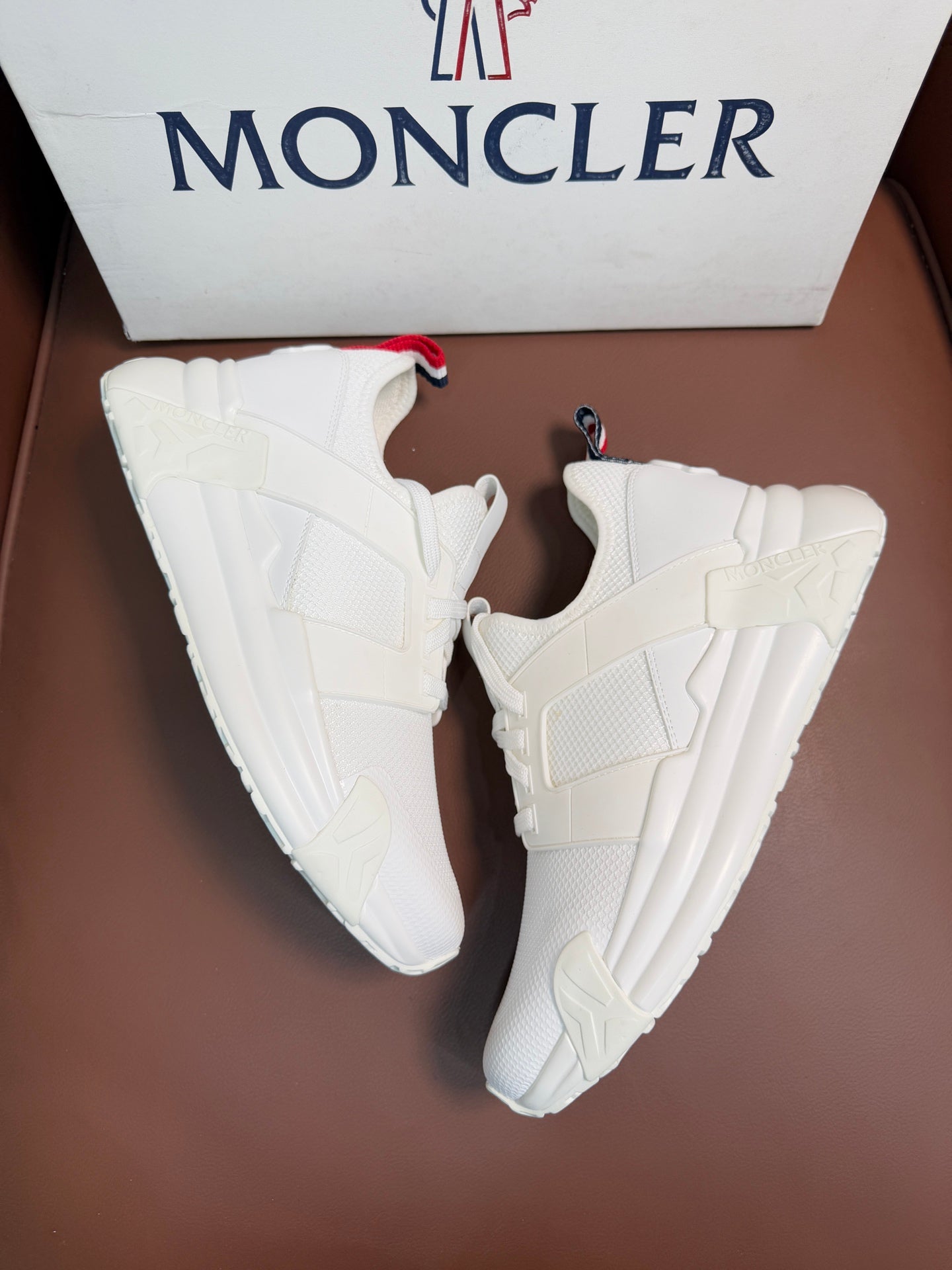 Moncler white lace-up sneakers, front angle, padded tongue and collar