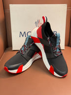 Moncler luxury shoes with black upper, red highlights, and multicolor striped heel detail