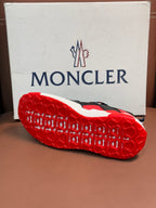Moncler luxury shoes outsole view with red tread and white midsole edge