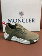 Moncler luxury sneakers in olive green with lace-up and bold white sole