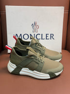 Moncler luxury sneakers in olive green with lace-up, striped detail, and white sole
