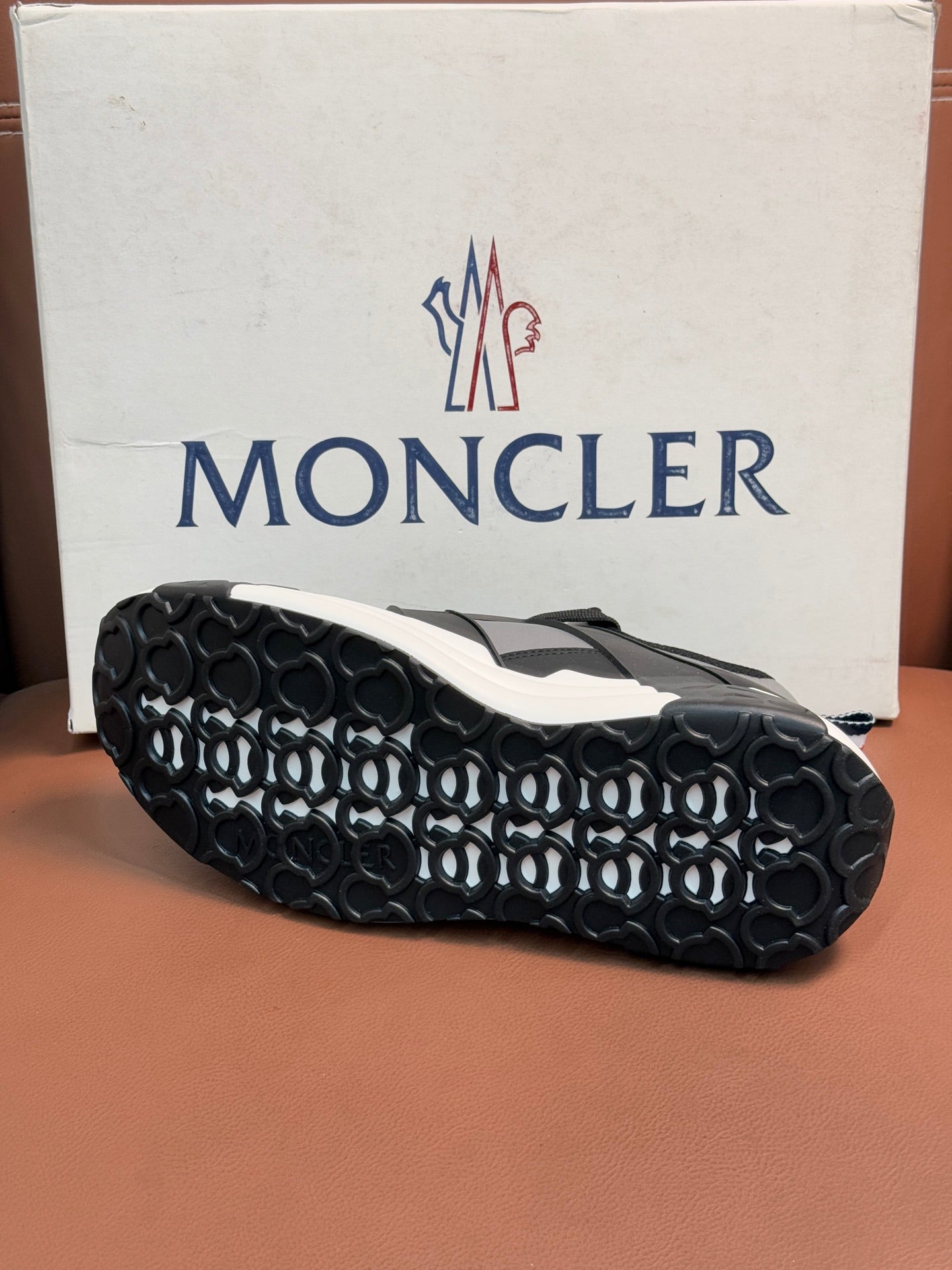 Moncler sneakers outsole view with patterned tread and white midsole edge