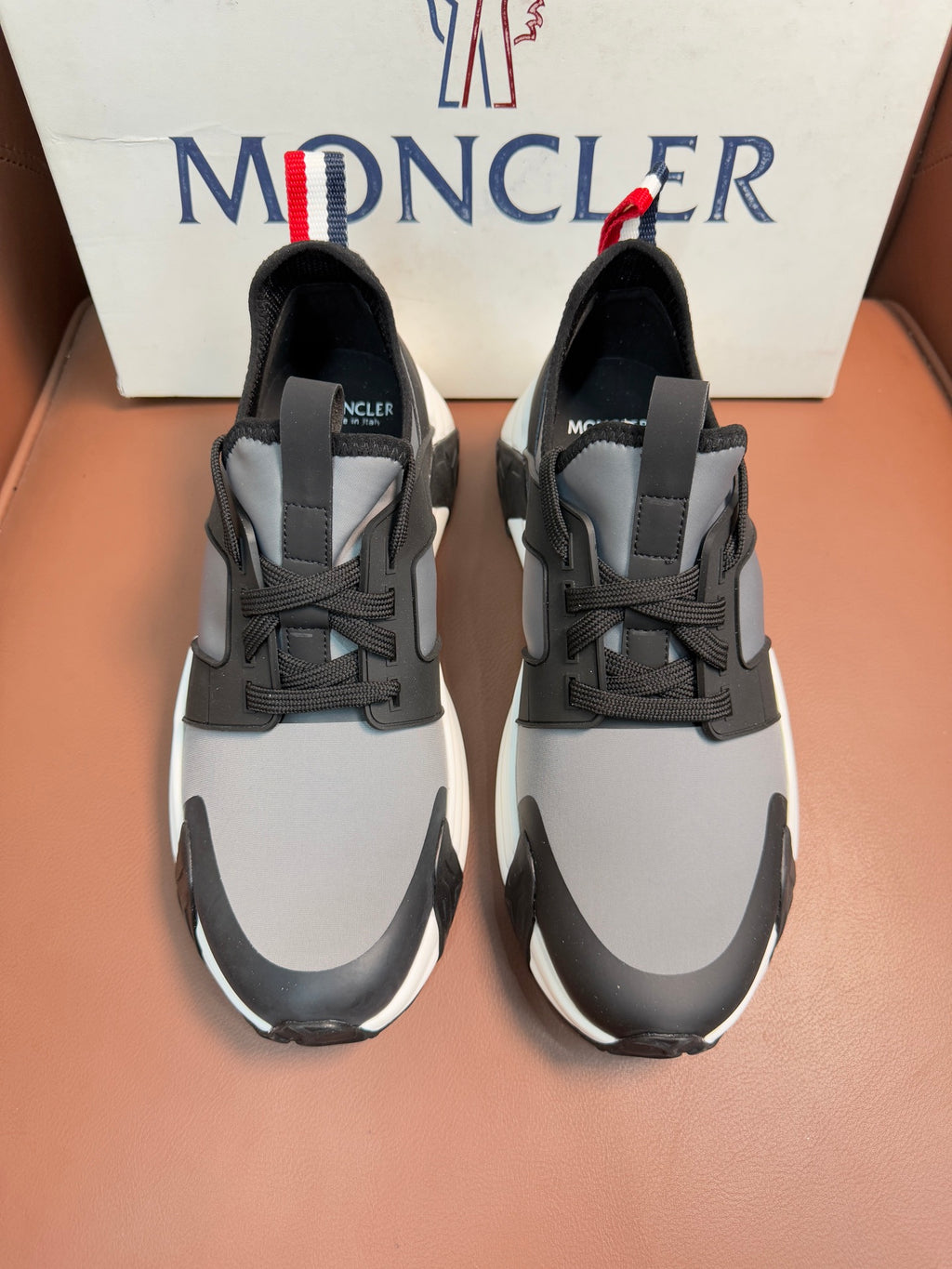 Moncler lace-up sneakers in dark gray with white soles and panel details