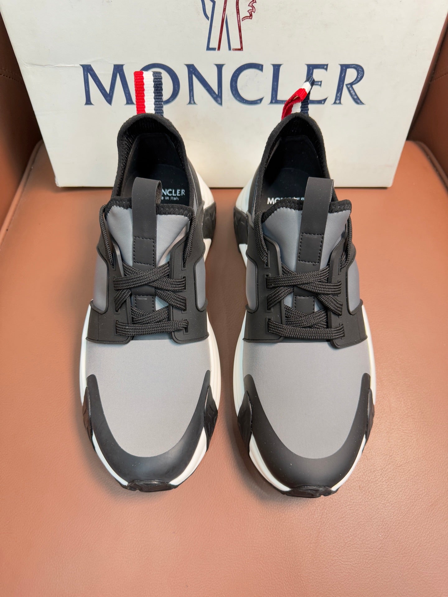 Moncler lace-up sneakers in dark gray with white soles and panel details