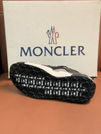 Moncler sneaker outsole with black rubber tread and white sidewall
