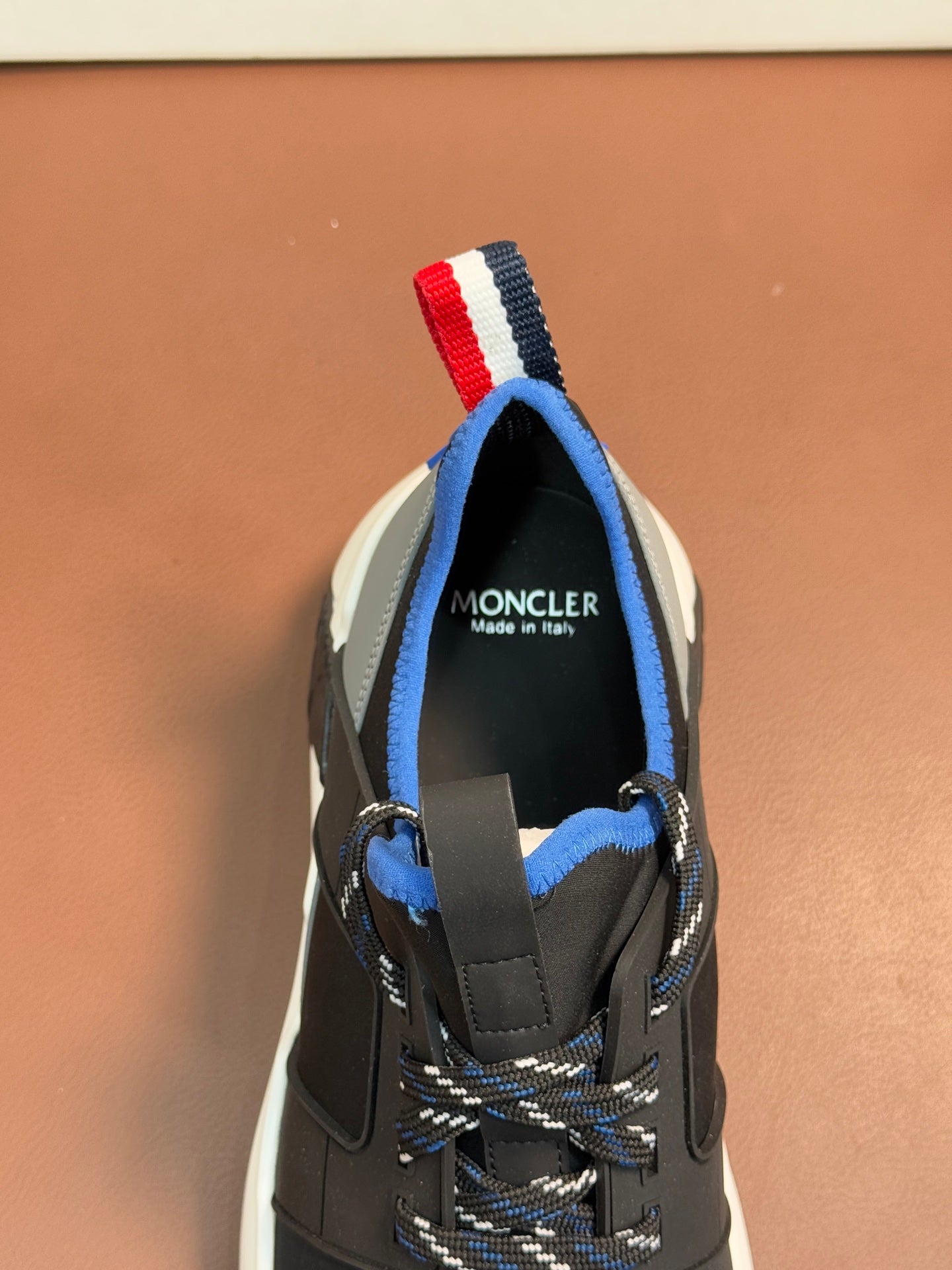 Moncler sneakers heel with blue lining and red-white-blue strap detail on top