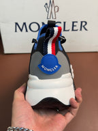 Moncler sneakers heel with blue logo patch and red-white-blue stripe pull tab