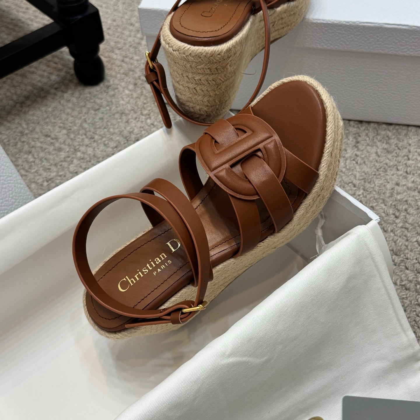 Tan espadrille platform slide sandals with knotted crossover straps and buckle