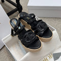 Black platform espadrille sandals with wide buckle straps and braided jute sole