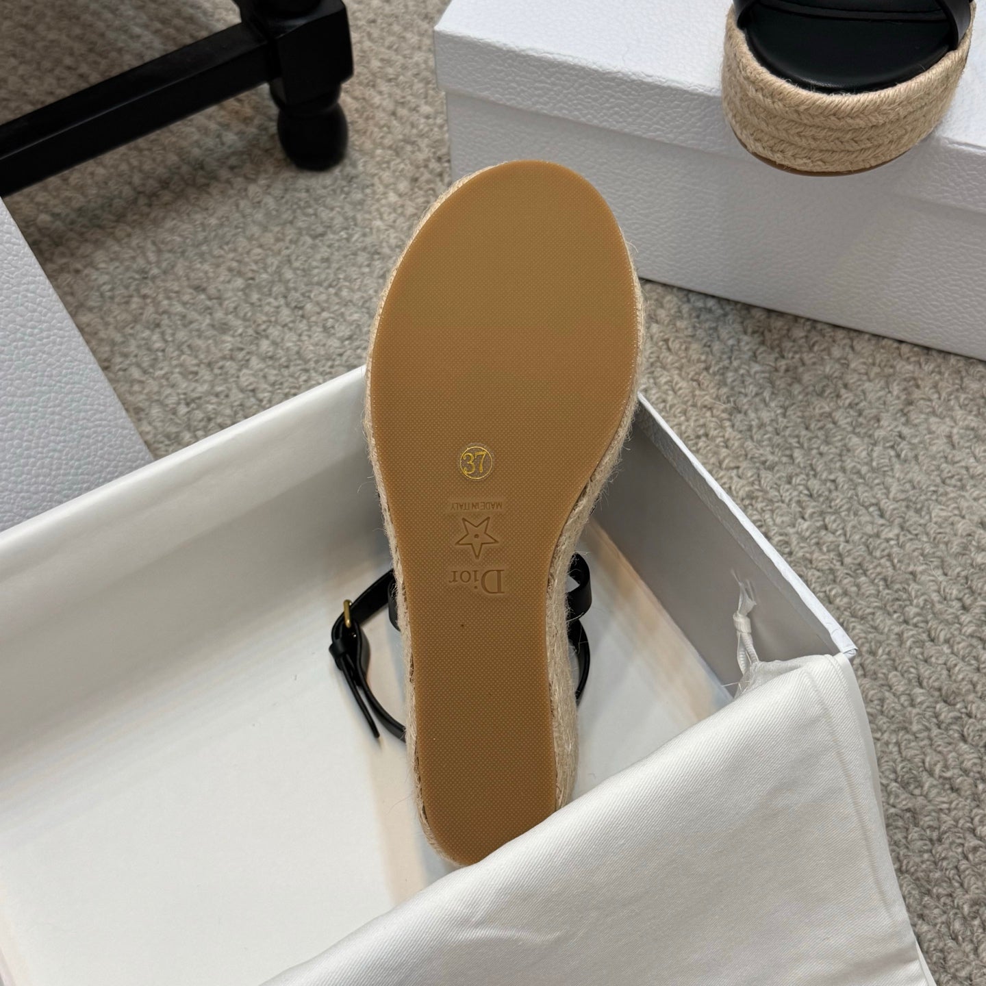 Platform espadrille sandal outsole with tan rubber tread and logo stamp