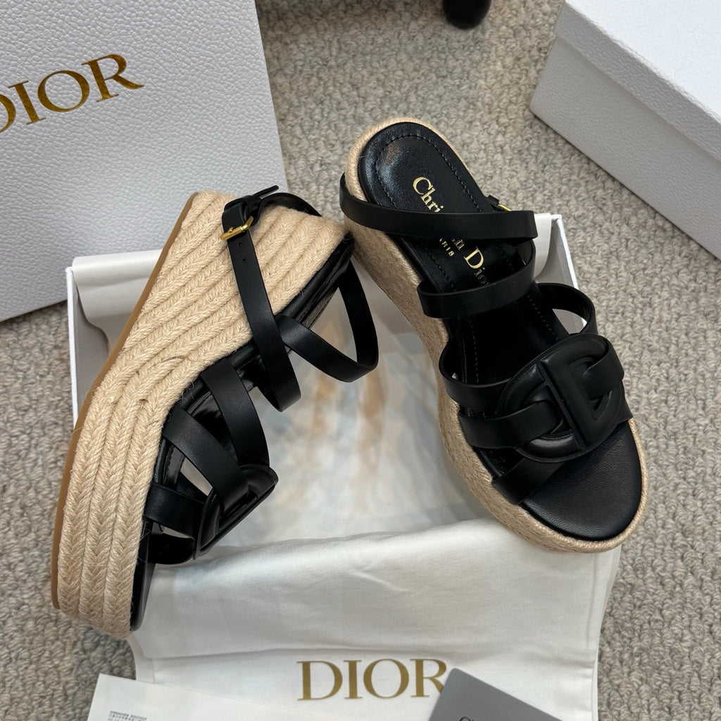 Two-tone platform espadrille sandals with black crossover straps and braided jute wedge